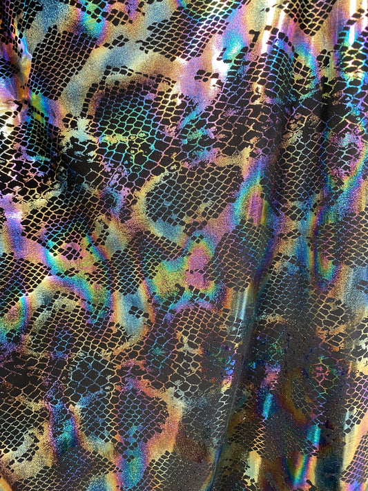 New Exotic cobra design Iridescent black hologram foil print on poly spandex 4-way stretch 58/60” Sold by the YD. Ships Worldwide from L.A