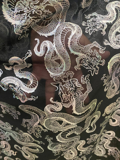 New Exotic Dragon design print on metallic power mesh nylon spandex 4-way stretch 58/60” Sold by the YD. Ships worldwide