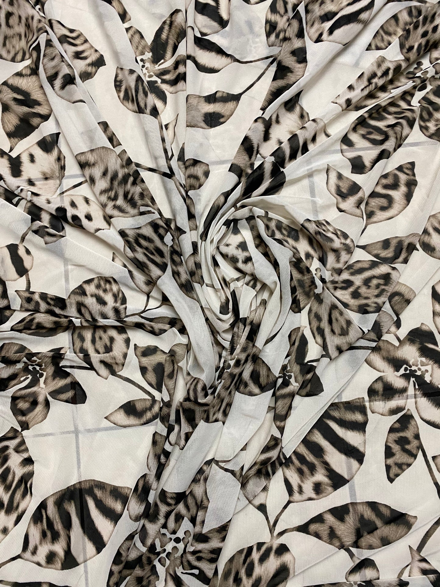 New Exotic flower animal print design on poly mesh 4-way stretch 58/60” Sold by the YD. Ships Worldwide from Los Angeles California USA.