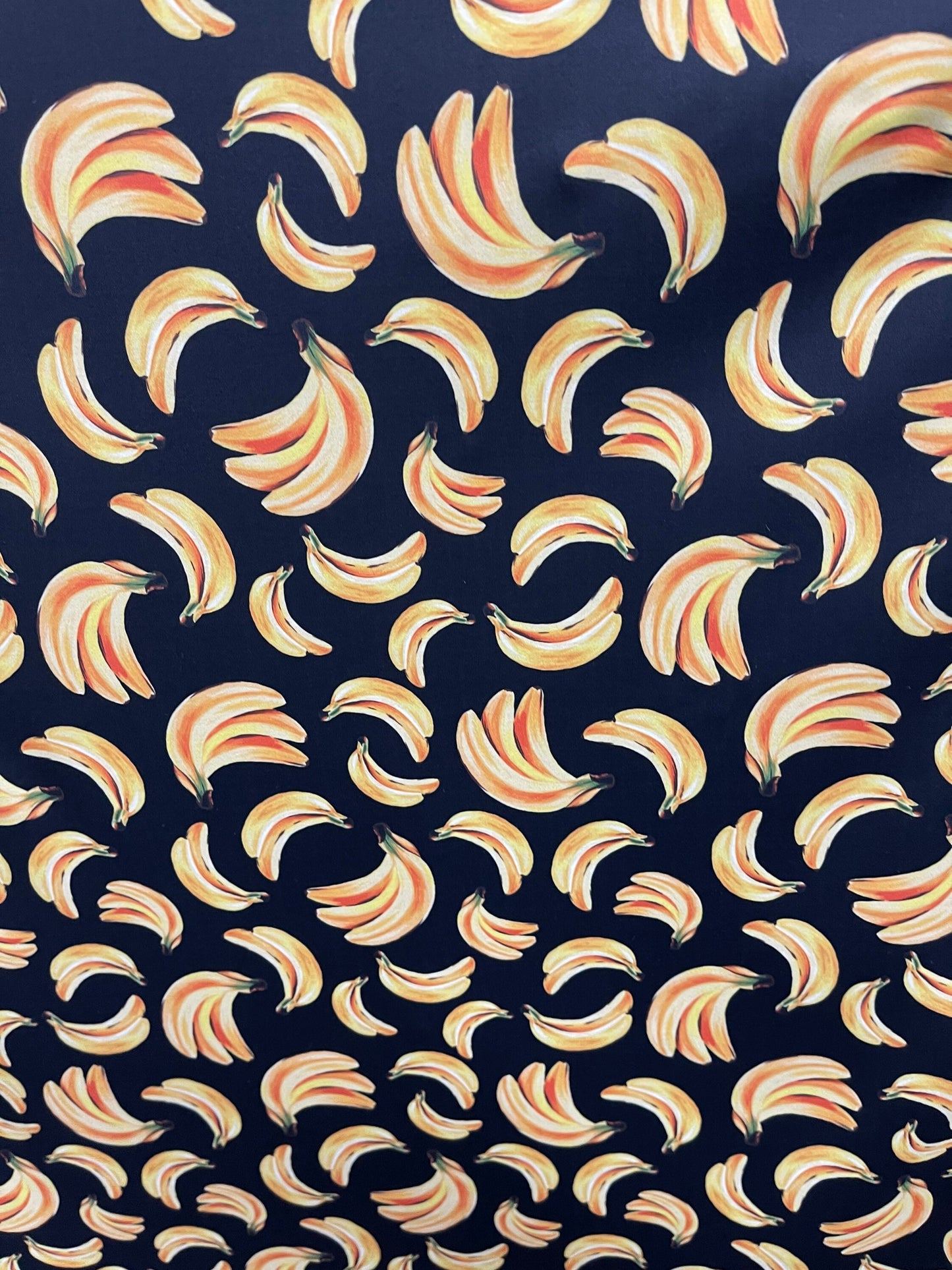 Bananas design black/yellow print on best nylon spandex 4way stretch 58/60” Sold by the YD. Ships worldwide from Los Angeles California USA.