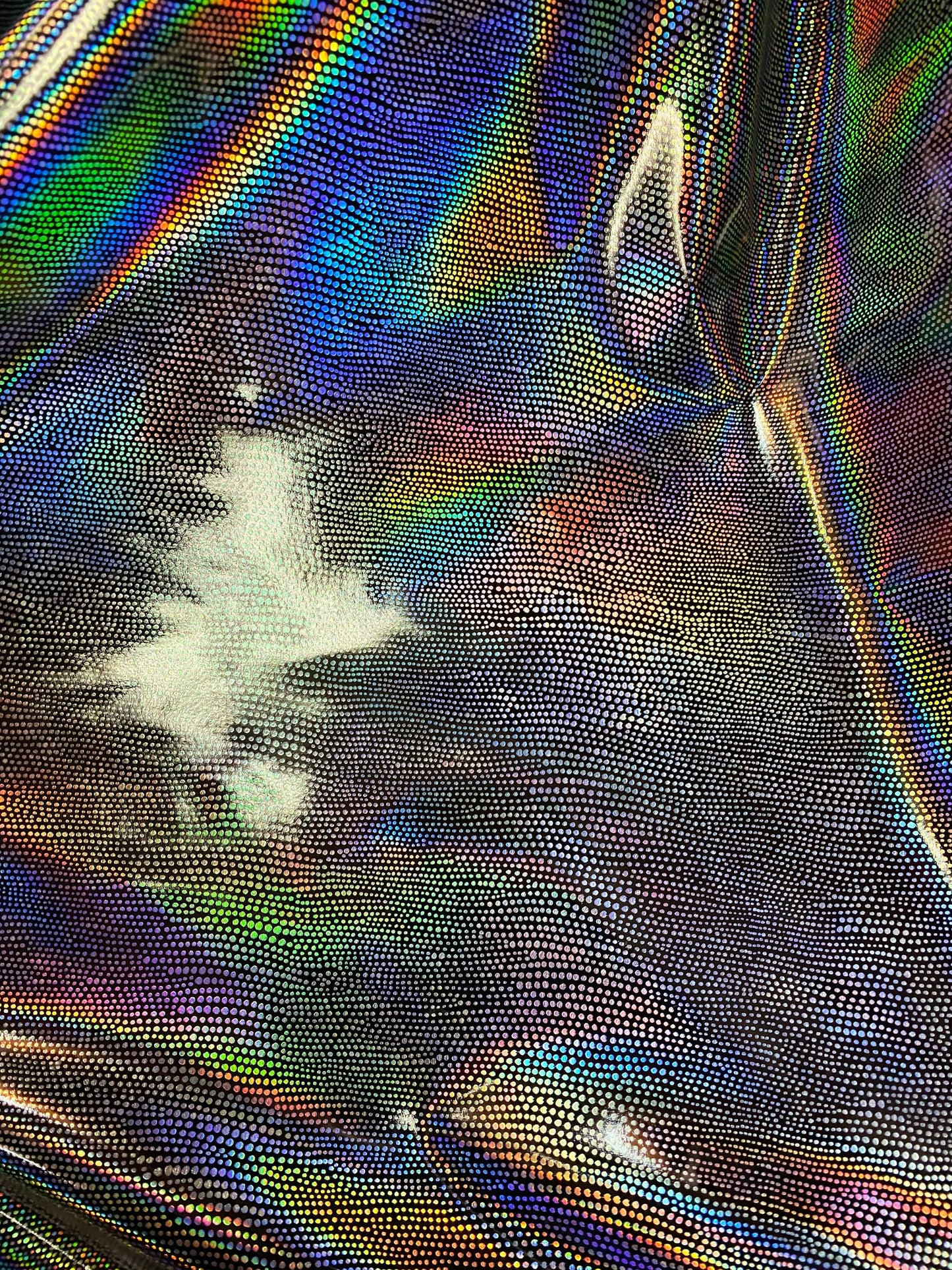 New iridescent Exotic Armadillo design hologram foil pu vinyl black/silver  2-way stretch medium weight 58/60” Sold by the YD.