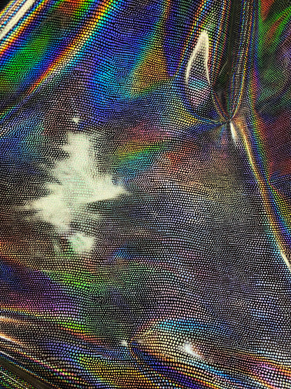 New iridescent Exotic Armadillo design hologram foil pu vinyl black/silver  2-way stretch medium weight 58/60” Sold by the YD.