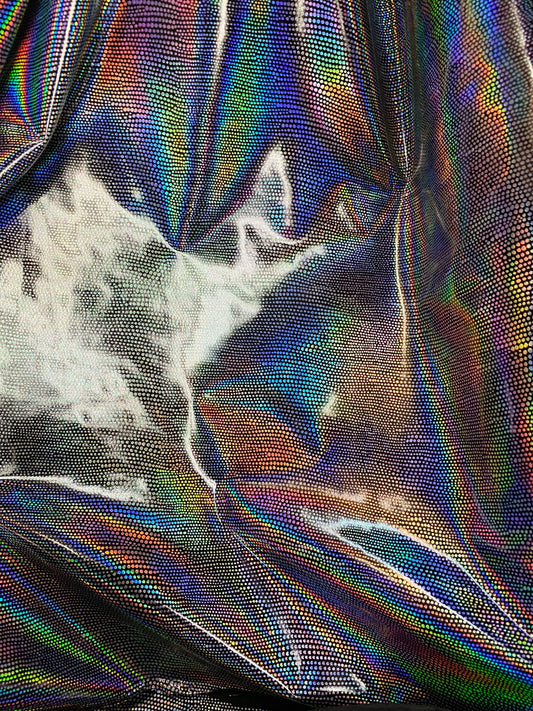 New iridescent Exotic Armadillo design hologram foil pu vinyl black/silver  2-way stretch medium weight 58/60” Sold by the YD.
