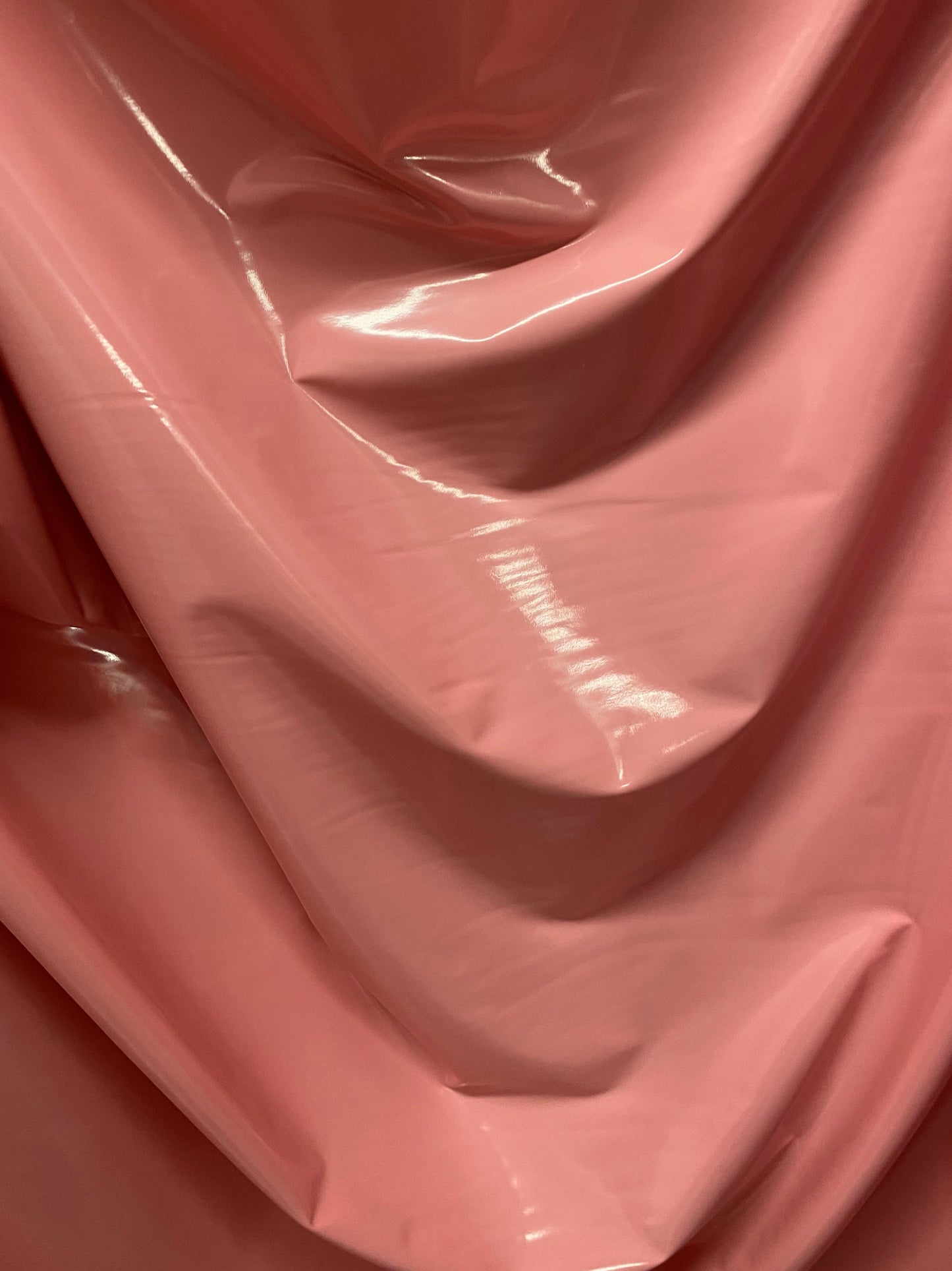 Shiny Latex  dusty rose color nylon spandex 4way stretch 58/60” Sold by the YD. Ships worldwide from Los Angeles California USA.