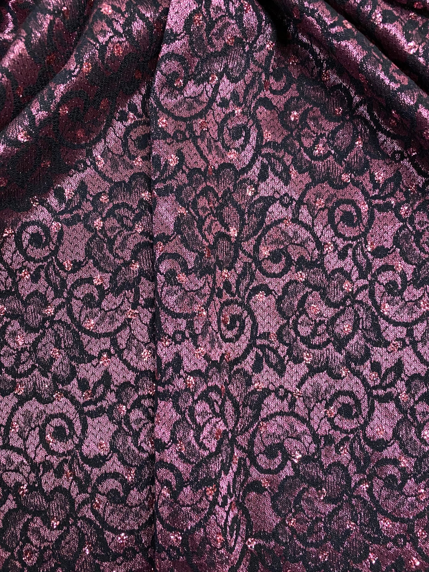 New lace Sofia design plum/black stretch lace with glitter dots 58/60” Sold by the YD. Ships Worldwide from Los Angeles California USA.