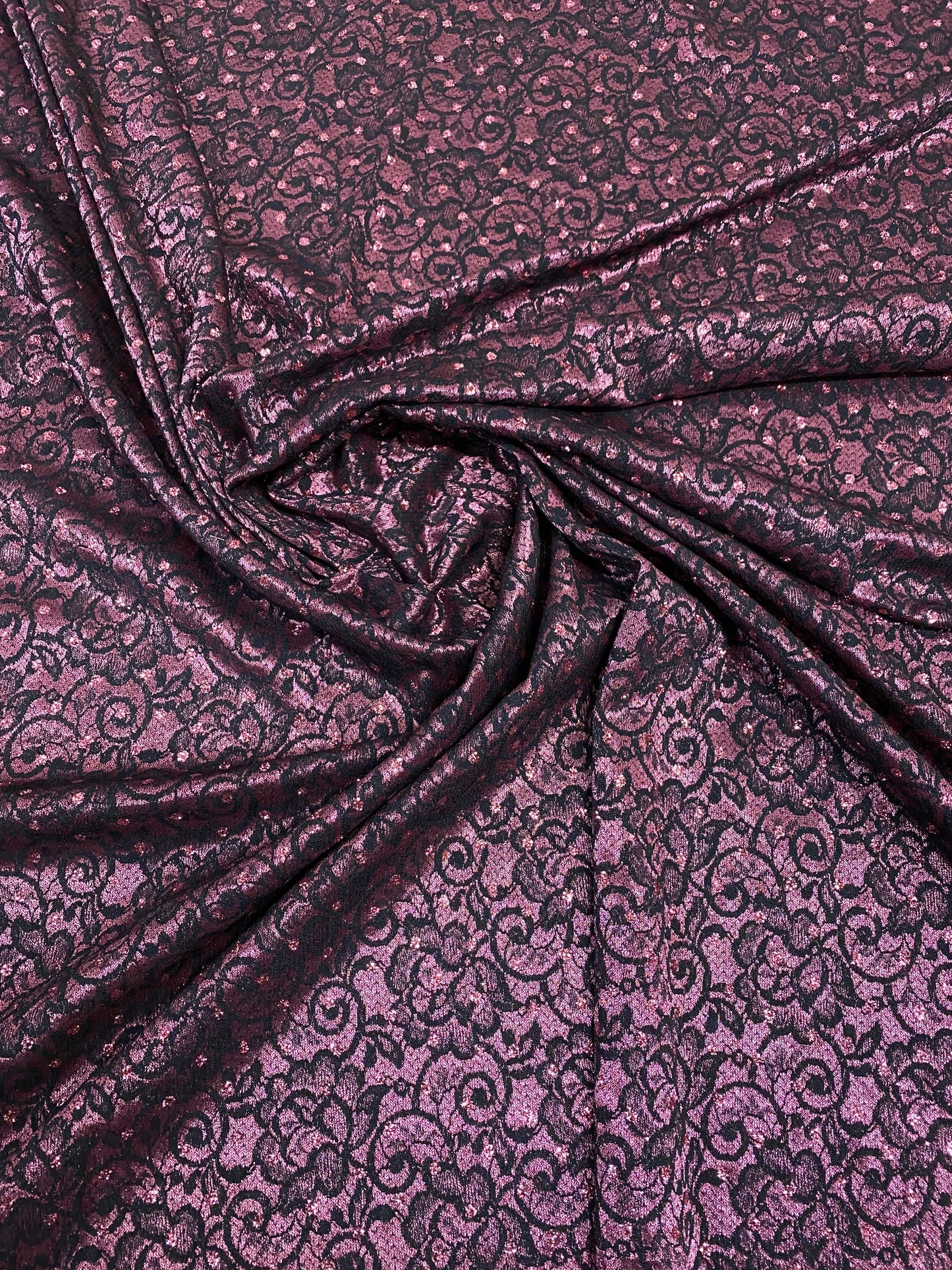 New lace Sofia design plum/black stretch lace with glitter dots 58/60” Sold by the YD. Ships Worldwide from Los Angeles California USA.