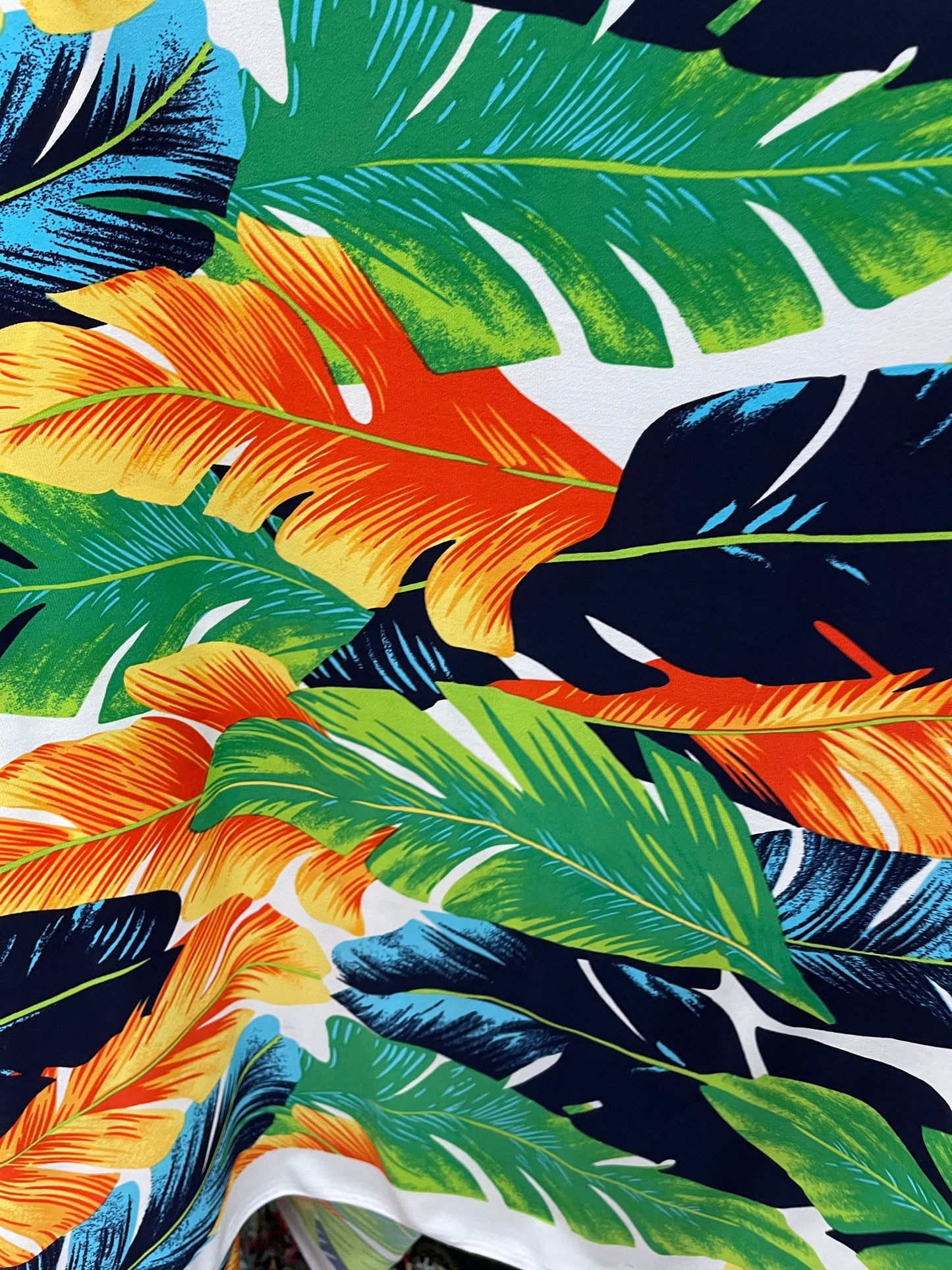 New tropical big leaf design multicolor print on poly spandex 4-way stretch medium weight 58/60” Sold by the YD. Ships Worldwide