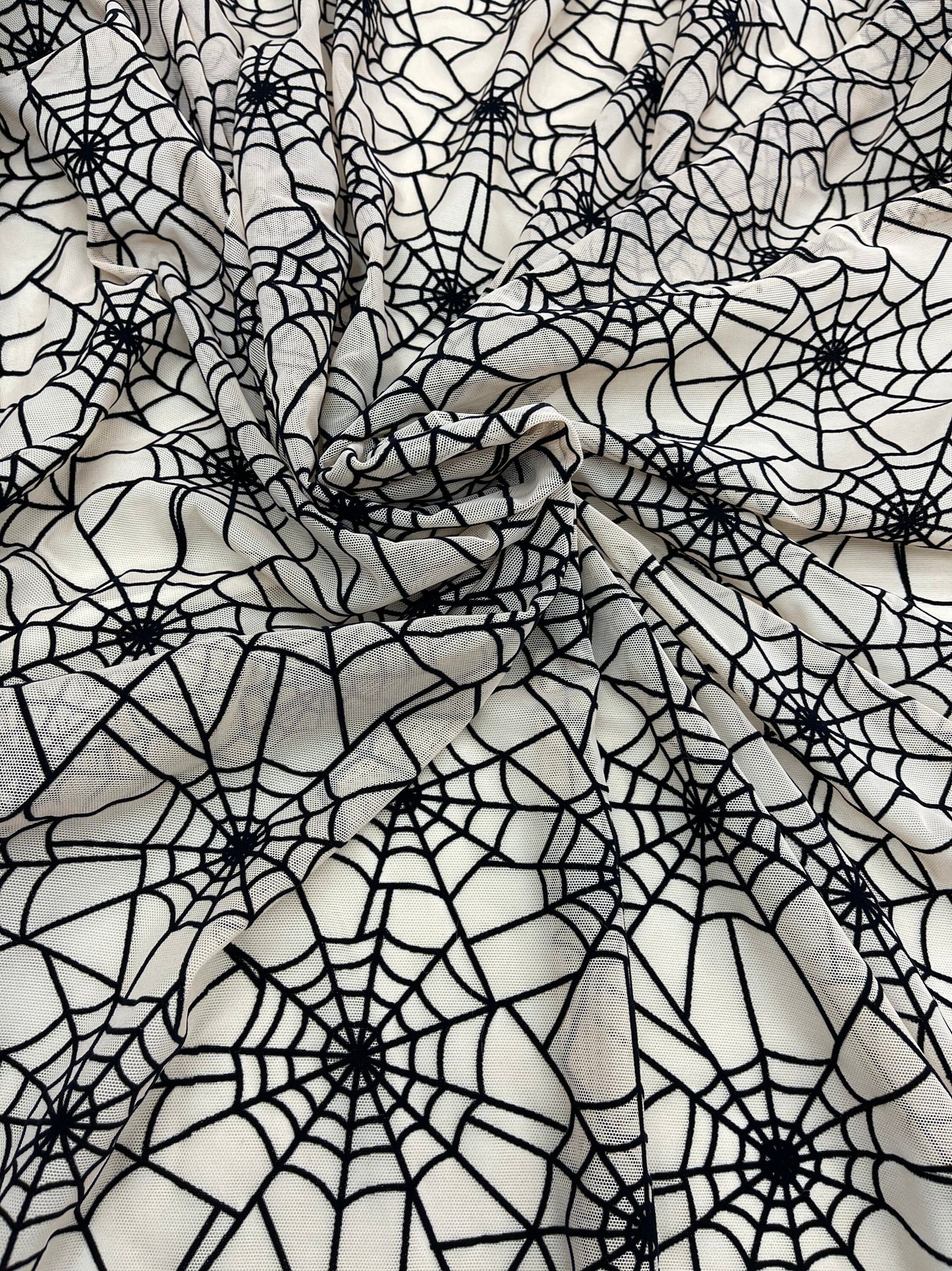 New Spider-Man design nude/back print on power mesh with flocking great quality nylon mesh 4-way stretch 58/60” Sold by the YD.