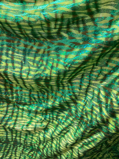 Disco Tiger design exotic hologram animal print metallic spandex 2-way stretch 58/60” Sold by the YD. Ships Worldwide from Los Angeles cali