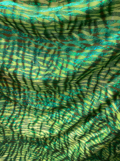 Disco Tiger design exotic hologram animal print metallic spandex 2-way stretch 58/60” Sold by the YD. Ships Worldwide from Los Angeles cali