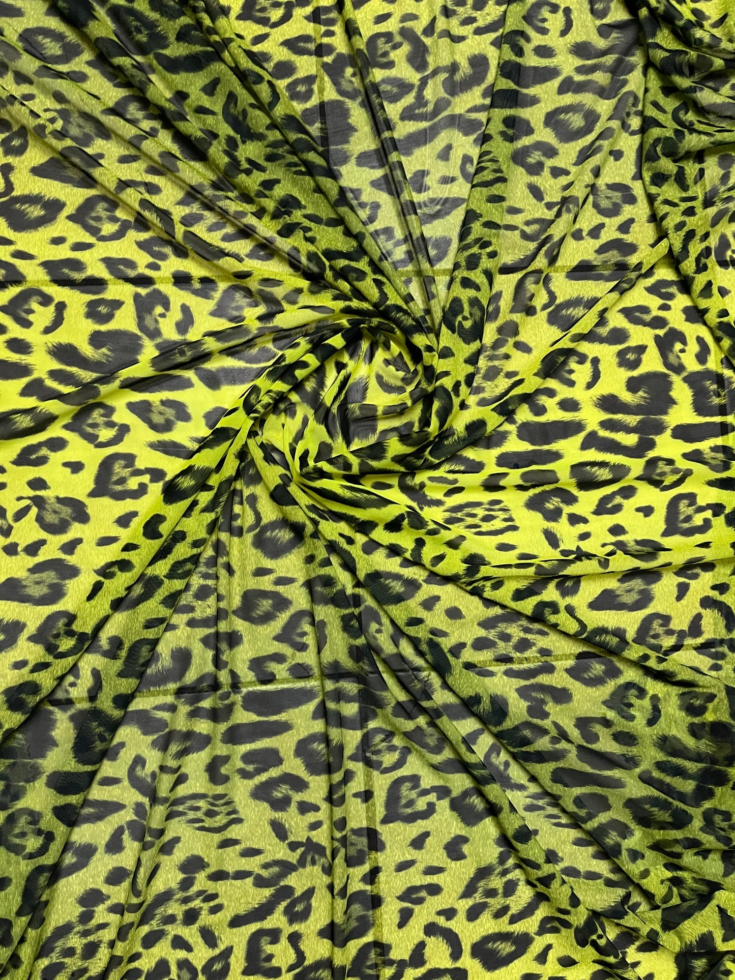 Exotic leopard design neon Yellow/black print on power mesh 4-way stretch 58/60” Sold by the YD. Ships Worldwide from Los Angeles California
