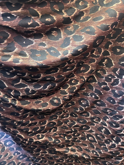 Leopard design print on nylon spandex;-way stretch Brown/Black 58/60” Sold by the YD. Ships Worldwide from Los Angeles California USA.