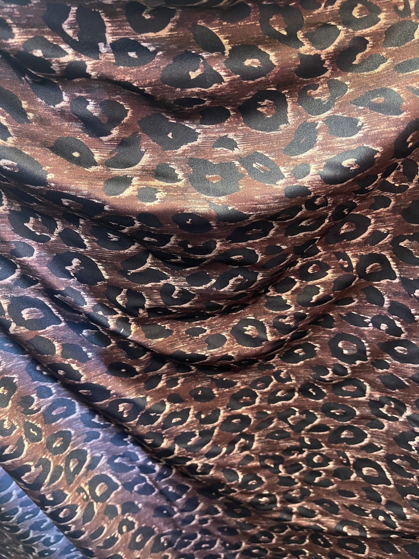 Leopard design print on nylon spandex;-way stretch Brown/Black 58/60” Sold by the YD. Ships Worldwide from Los Angeles California USA.
