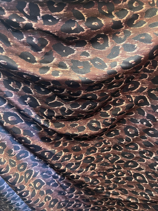 Leopard design print on nylon spandex;-way stretch Brown/Black 58/60” Sold by the YD. Ships Worldwide from Los Angeles California USA.