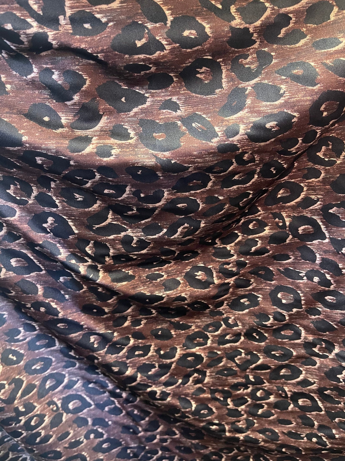Leopard design print on nylon spandex;-way stretch Brown/Black 58/60” Sold by the YD. Ships Worldwide from Los Angeles California USA.