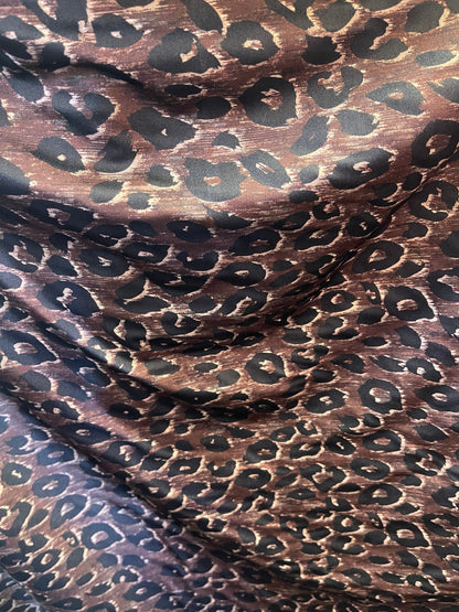 Leopard design print on nylon spandex;-way stretch Brown/Black 58/60” Sold by the YD. Ships Worldwide from Los Angeles California USA.