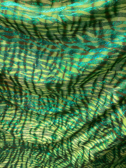 Disco Tiger design exotic hologram animal print metallic spandex 2-way stretch 58/60” Sold by the YD. Ships Worldwide from Los Angeles cali