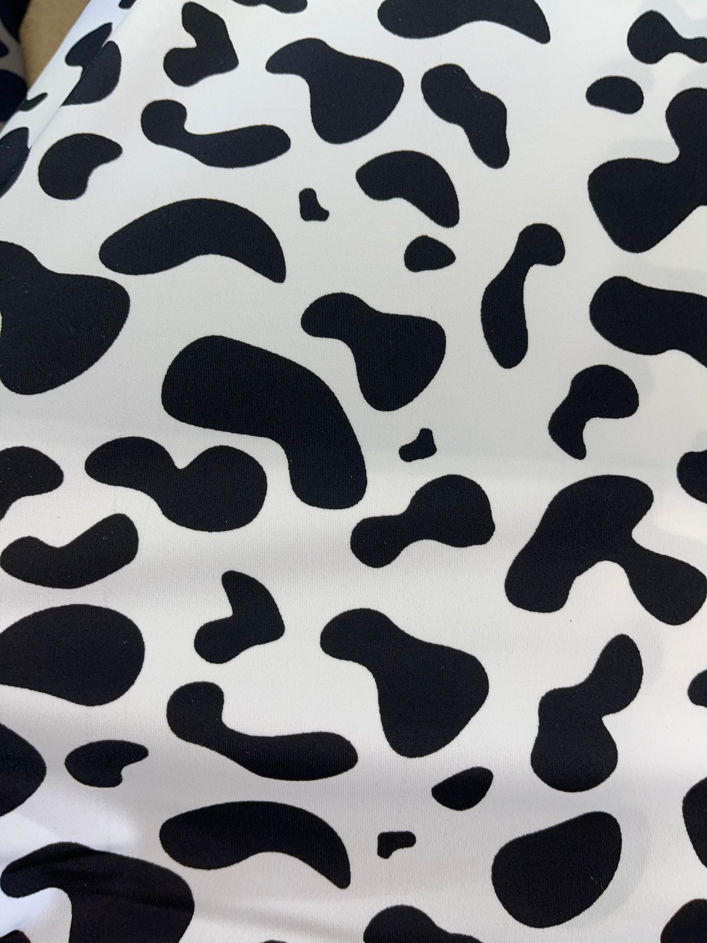 New Exotic cow design White/black print on best quality of nylon spandex 4-way stretch 58/60” Sold by the YD. Ships Worldwide from Los Angel
