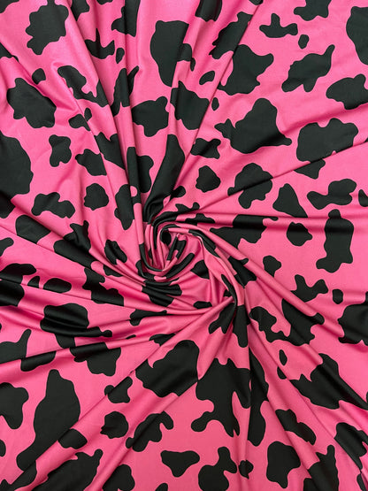 Moo Moo cow design Fuchsia/black print on best quality of nylon spandex 4-way stretch 58/60” Sold by the YD. Ships Worldwide from Los Angele