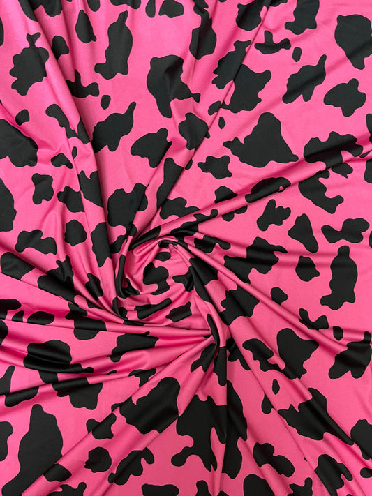 Moo Moo cow design Fuchsia/black print on best quality of nylon spandex 4-way stretch 58/60” Sold by the YD. Ships Worldwide from Los Angele