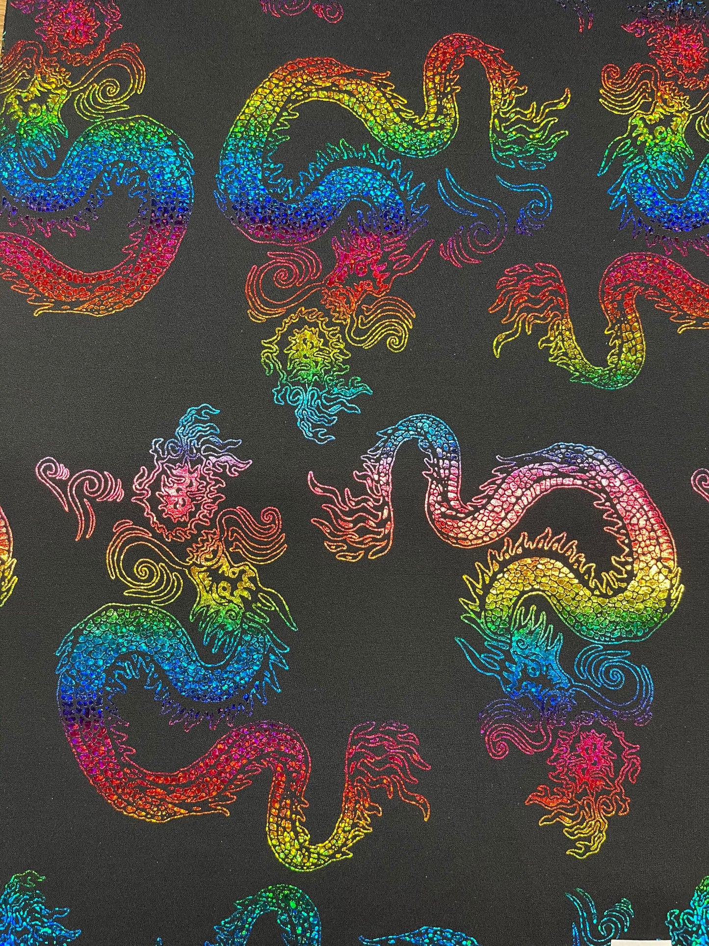 Exotic Dancing Dragón design hologram nylon spandex 4-way stretch 58/60” Sold by the YD. Ships Worldwide from Los Angeles California USA.