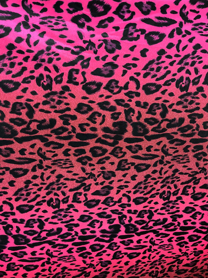 Exotic leopard design print on nylon spandex ;-way stretch Hop pink/black 58/60” Sold by the YD. Ships Worldwide from Los Angeles California