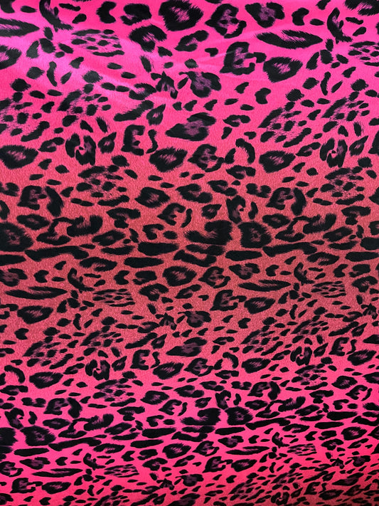 Exotic leopard design print on nylon spandex ;-way stretch Hop pink/black 58/60” Sold by the YD. Ships Worldwide from Los Angeles California
