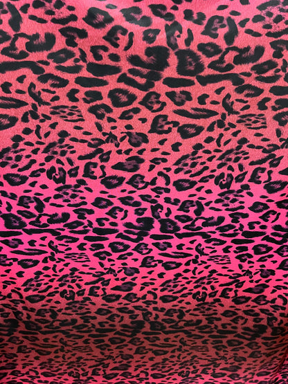 Exotic leopard design print on nylon spandex ;-way stretch Hop pink/black 58/60” Sold by the YD. Ships Worldwide from Los Angeles California