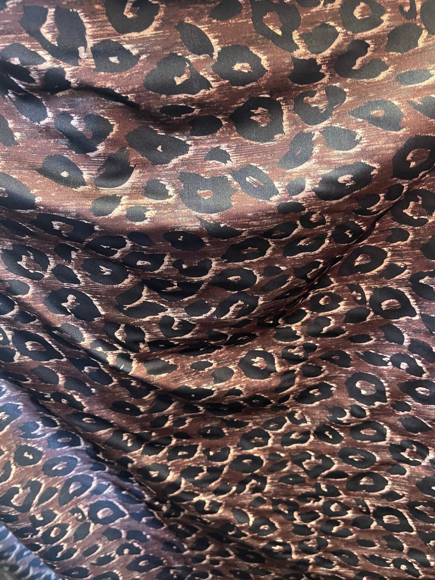 Leopard design print on nylon spandex;-way stretch Brown/Black 58/60” Sold by the YD. Ships Worldwide from Los Angeles California USA.