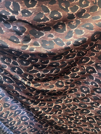 Leopard design print on nylon spandex;-way stretch Brown/Black 58/60” Sold by the YD. Ships Worldwide from Los Angeles California USA.