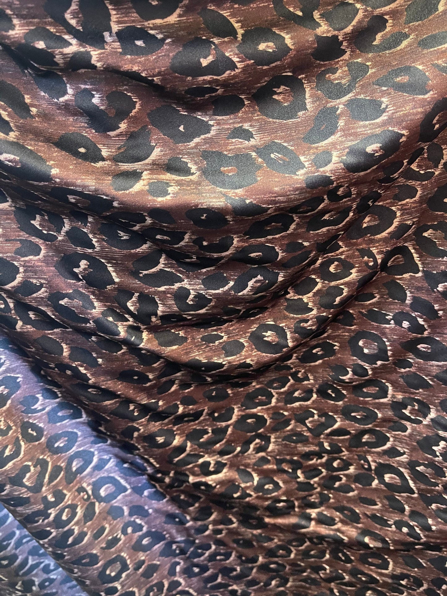 Leopard design print on nylon spandex;-way stretch Brown/Black 58/60” Sold by the YD. Ships Worldwide from Los Angeles California USA.