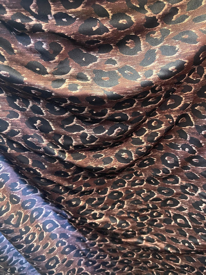 Leopard design print on nylon spandex;-way stretch Brown/Black 58/60” Sold by the YD. Ships Worldwide from Los Angeles California USA.