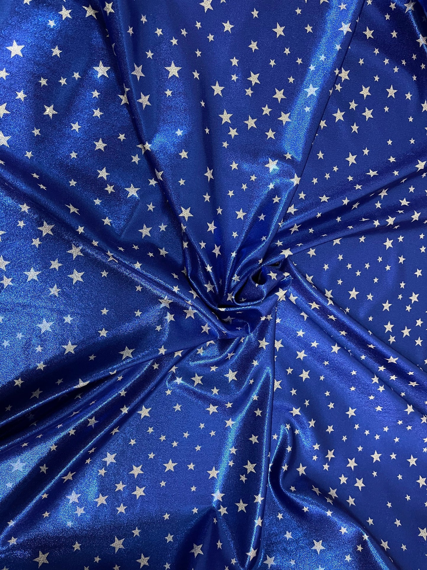 Stars design freedom Blue/White small stars print on metallic nylon spandex 4-way stretch 58/60” Sold by the YD. Ships Worldwide from L.A CA