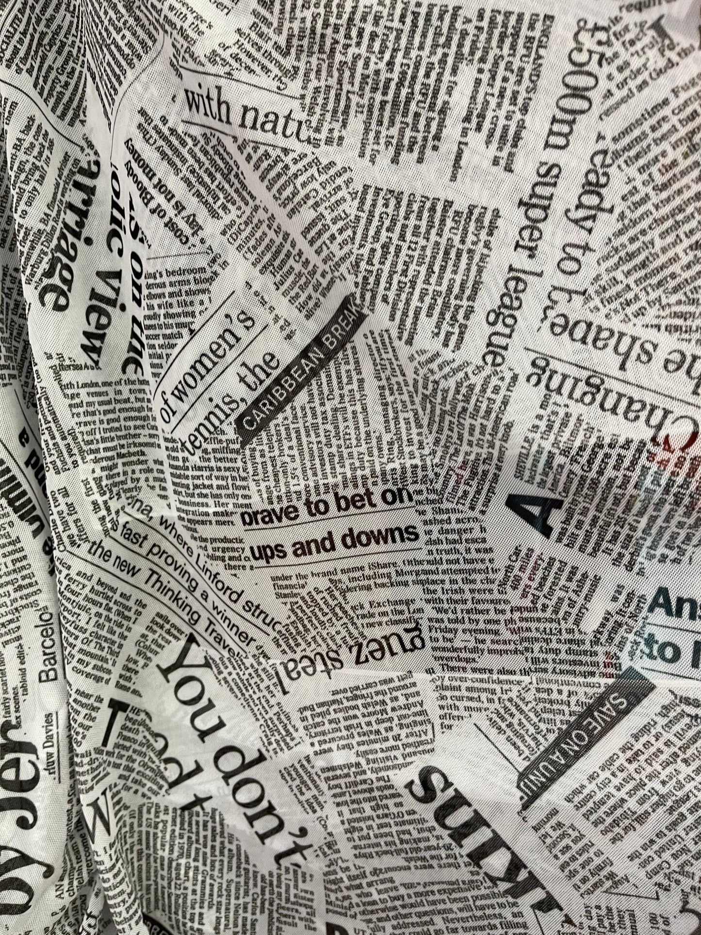 Newspaper design print on great quality of power mesh 4-way stretch 58/60” Sold by the YD. Ships Worldwide from Los Angeles California USA.