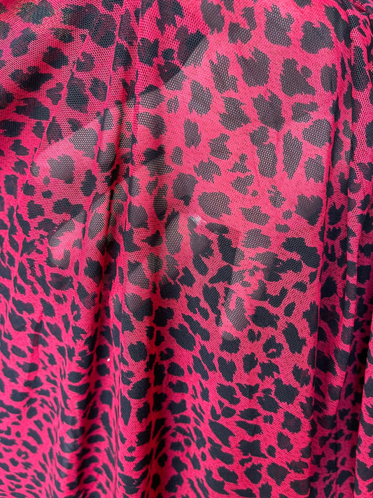 New power mesh animal printCheetah design red/black 4-way stretch 58/60” Sold by the YD. Ships worldwide from Los Angeles California USA.