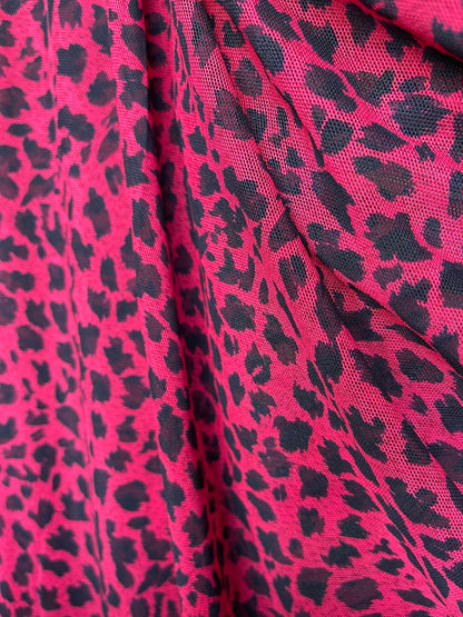 New power mesh animal printCheetah design red/black 4-way stretch 58/60” Sold by the YD. Ships worldwide from Los Angeles California USA.