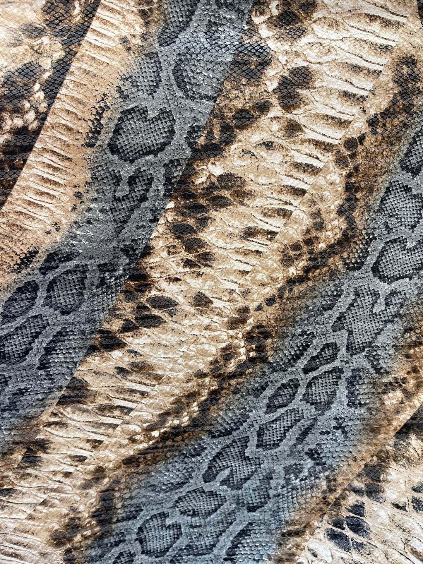 New snake design print on Poly spandex 2-way stretch medium weight 58/60” Sold by the YD. Ships Worldwide from Los Angeles California USA.