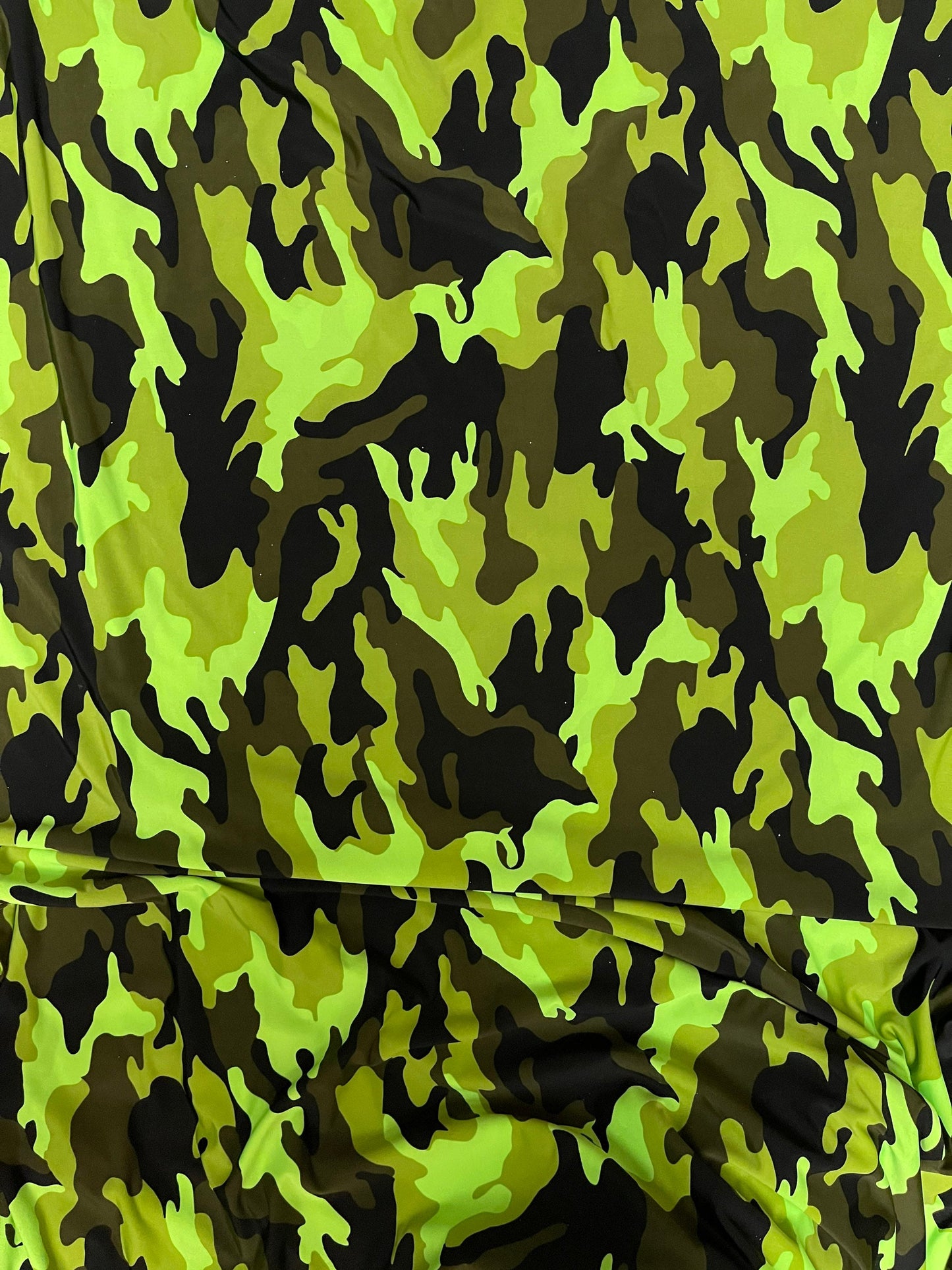 Camouflage design neon colors print on poly spandex 4-way stretch 58/60” Sold by the YD. Ships Worldwide from Los Ángeles California USA.