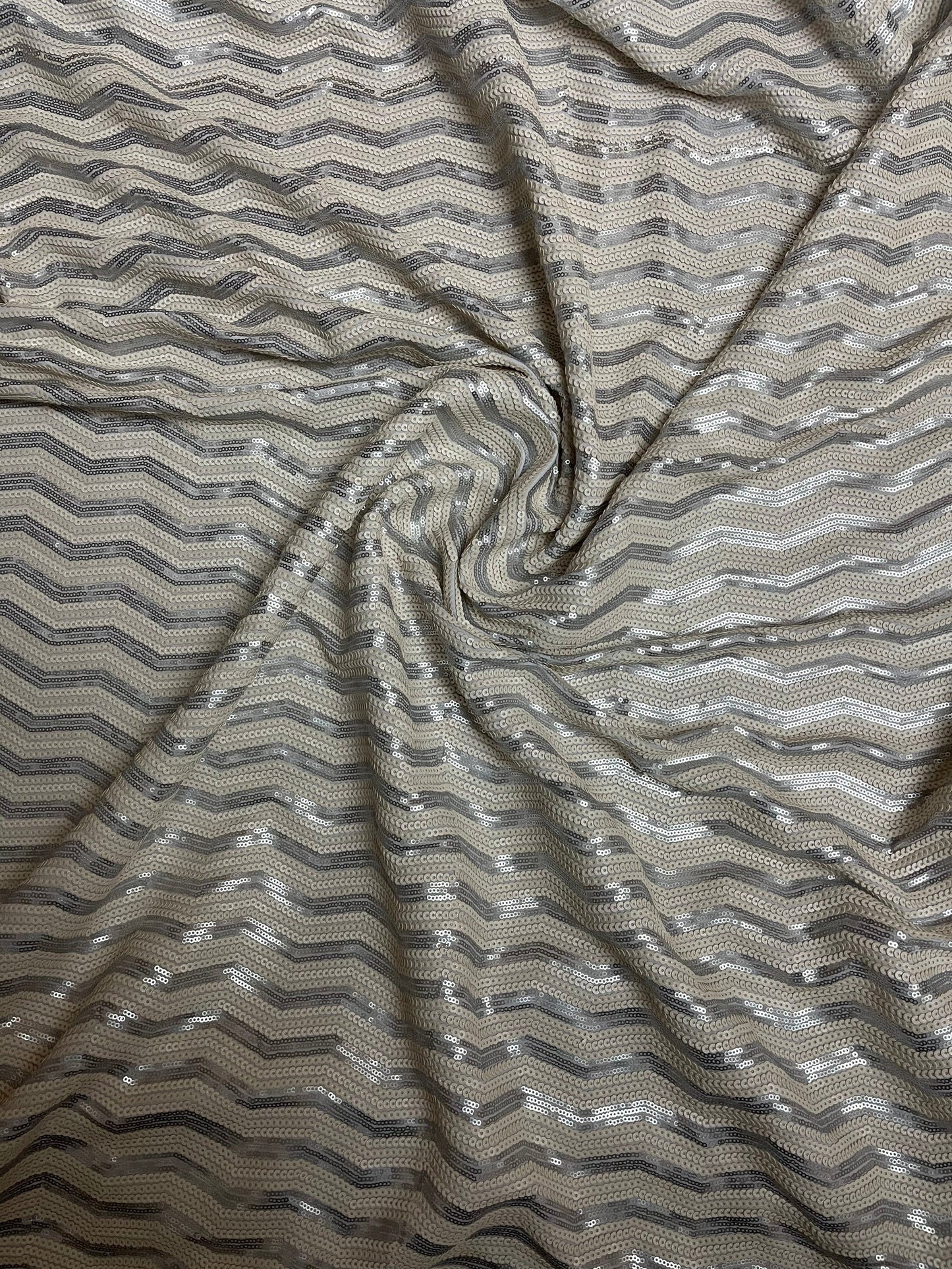 Luxury Chevron design embroidered on spandex base 2-way stretch silver/pearl white sequins 58/60” Sold by the YD. Ships Worldwide from L.A