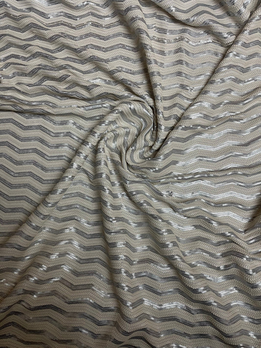 Luxury Chevron design embroidered on spandex base 2-way stretch silver/pearl white sequins 58/60” Sold by the YD. Ships Worldwide from L.A