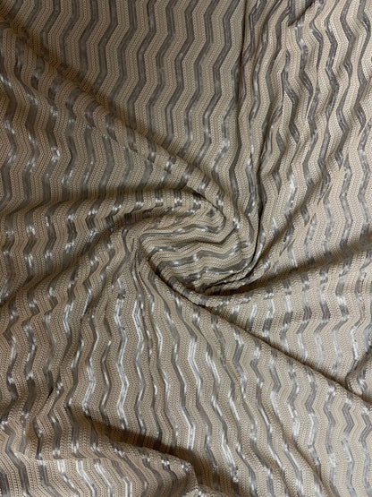 Luxury Chevron design embroidered on spandex base 2-way stretch silver/pearl white sequins 58/60” Sold by the YD. Ships Worldwide from L.A