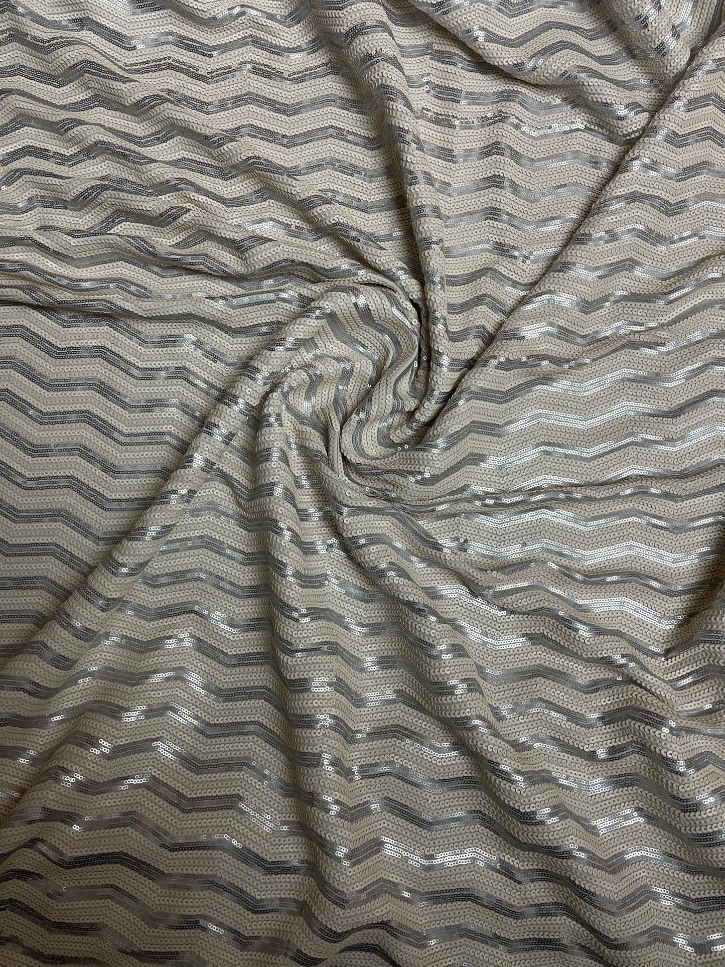 Luxury Chevron design embroidered on spandex base 2-way stretch silver/pearl white sequins 58/60” Sold by the YD. Ships Worldwide from L.A