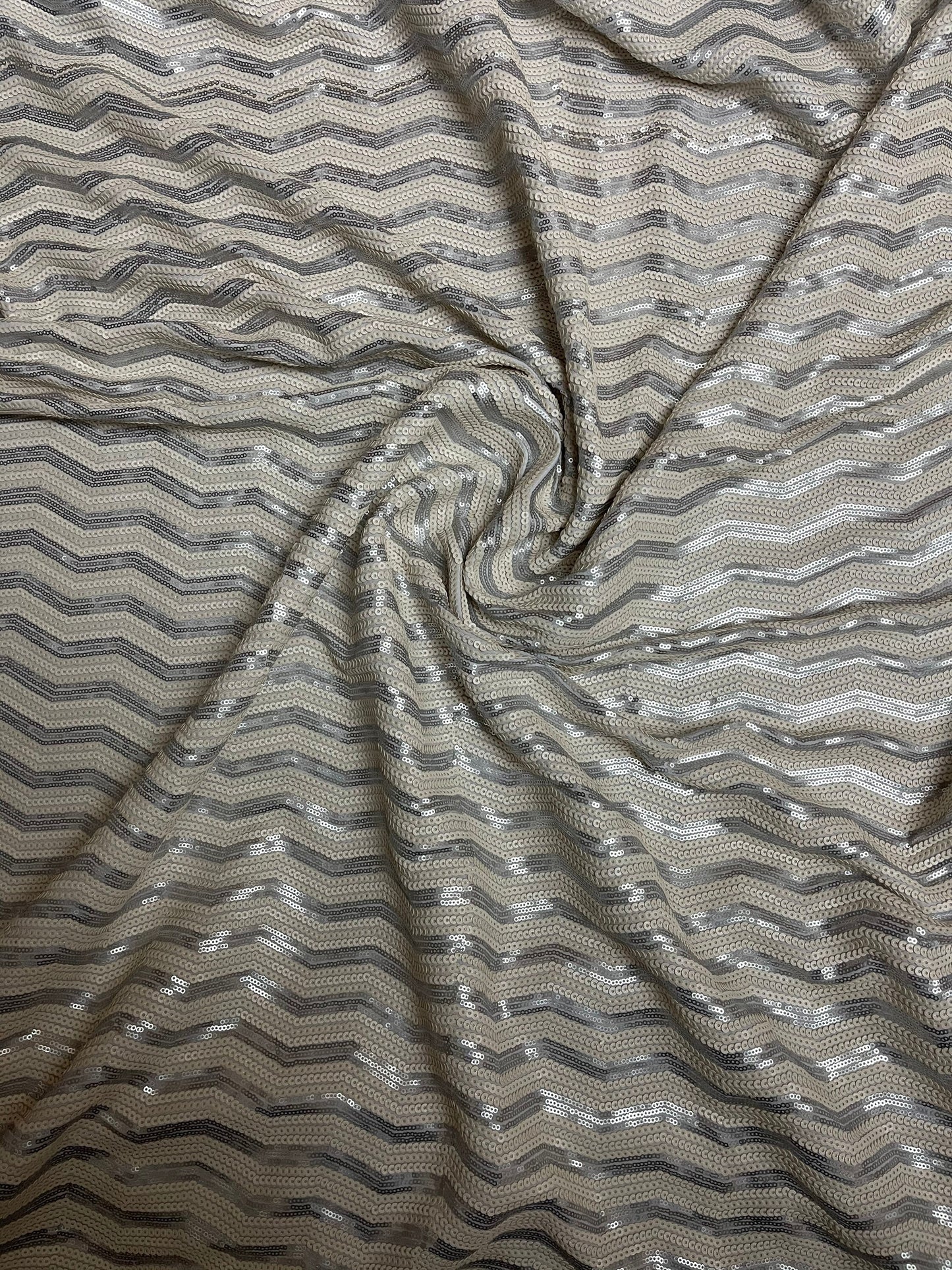 Luxury Chevron design embroidered on spandex base 2-way stretch silver/pearl white sequins 58/60” Sold by the YD. Ships Worldwide from L.A