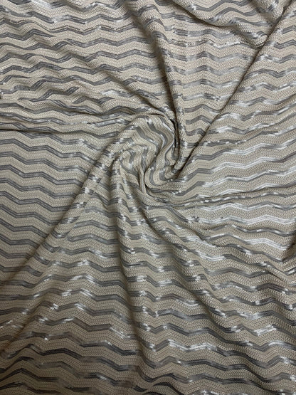 Luxury Chevron design embroidered on spandex base 2-way stretch silver/pearl white sequins 58/60” Sold by the YD. Ships Worldwide from L.A