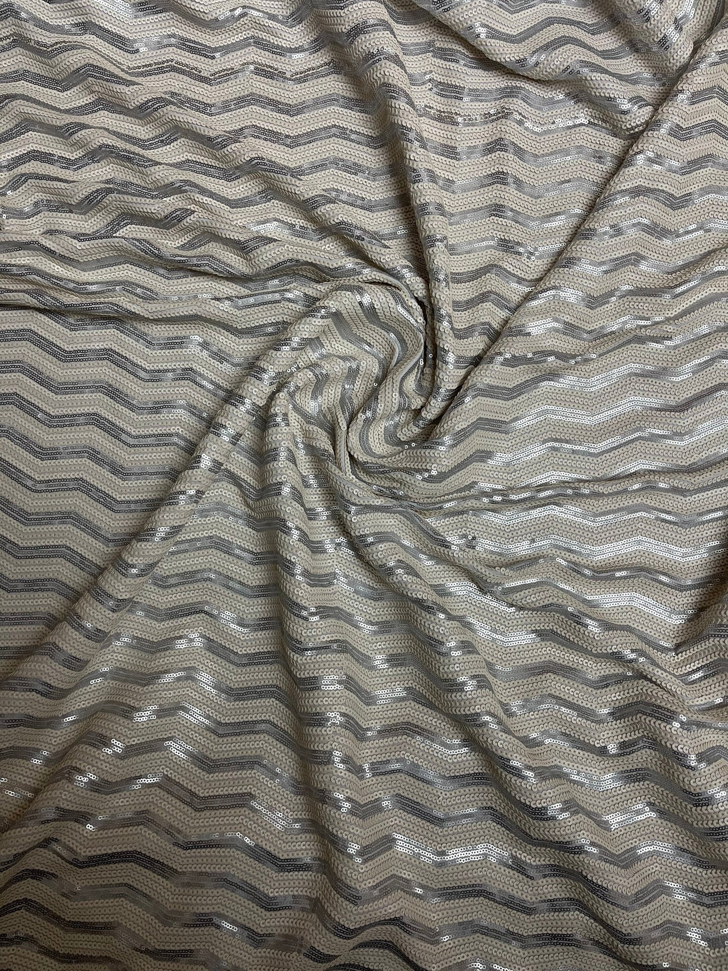 Luxury Chevron design embroidered on spandex base 2-way stretch silver/pearl white sequins 58/60” Sold by the YD. Ships Worldwide from L.A