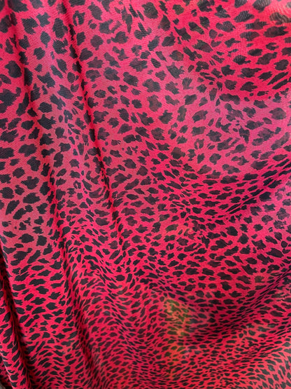 New power mesh animal print leopard design red/black 4-way stretch 58/60” Sold by the YD. Ships worldwide from Los Angeles California USA.