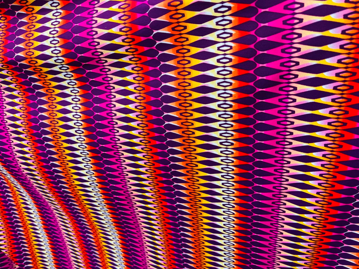 Geometric design Magenta/Multicolor print on best quality of nylon spandex 4-way stretch 58/60” Sold by the YD. Ships Worldwide