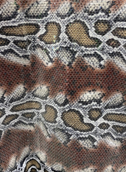 Python snake design print on poly spandex with clear sequins all over 2-way stretch 55/57” Sold by the YD. Ships Worldwide from L.A