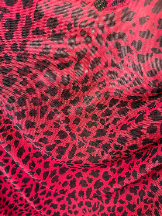 New power mesh animal print leopard design red/black 4-way stretch 58/60” Sold by the YD. Ships worldwide from Los Angeles California USA.