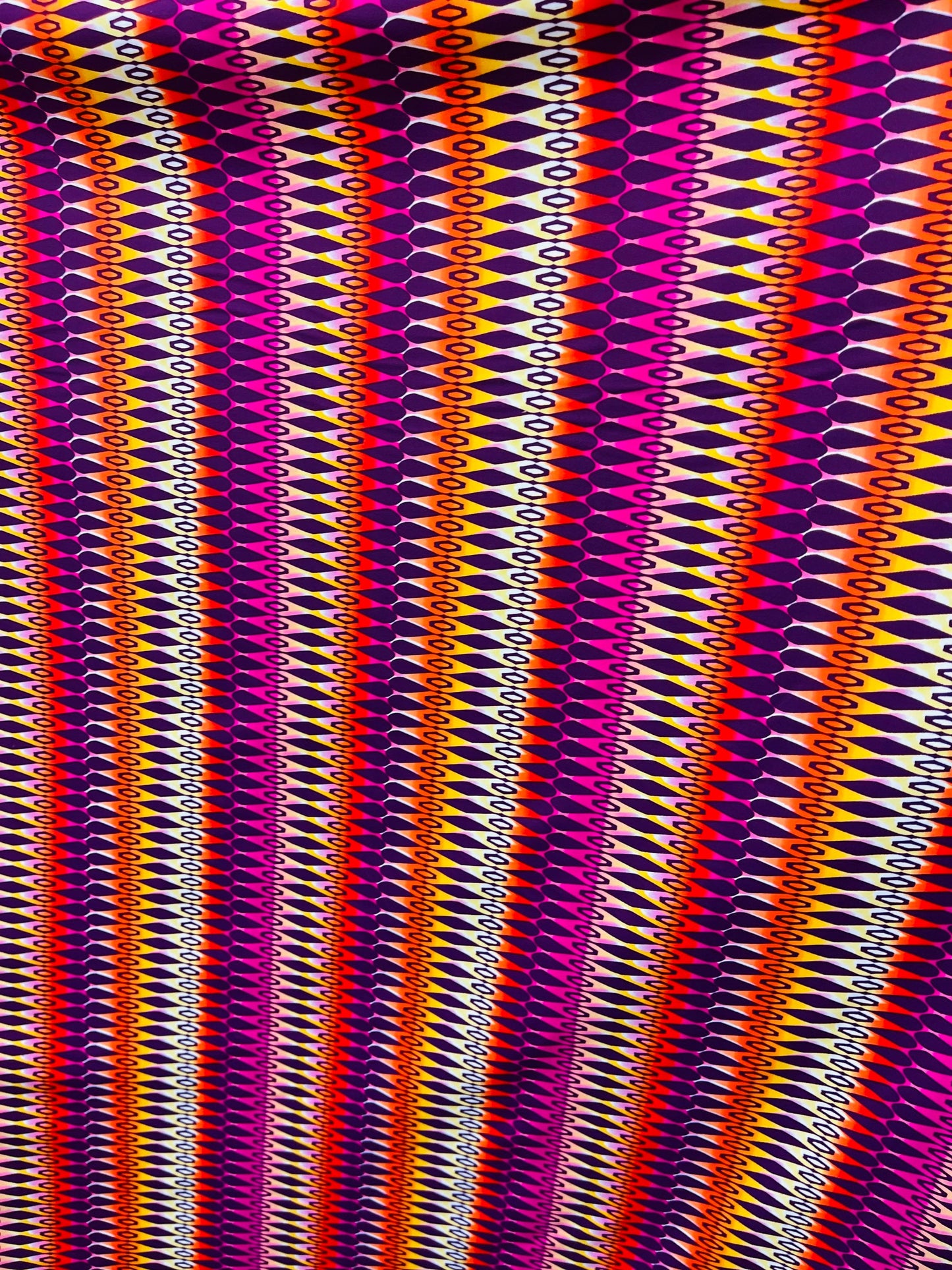 Geometric design Magenta/Multicolor print on best quality of nylon spandex 4-way stretch 58/60” Sold by the YD. Ships Worldwide